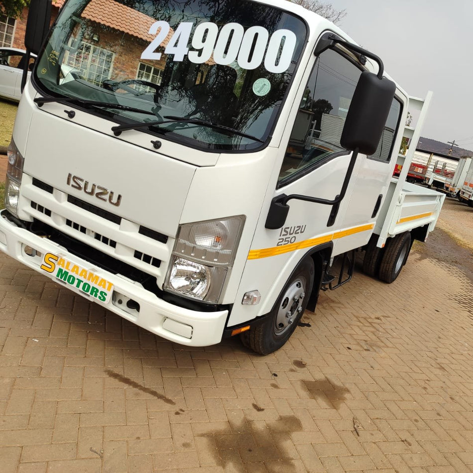 2005 Isuzu NMR 250 crew cab drop sides