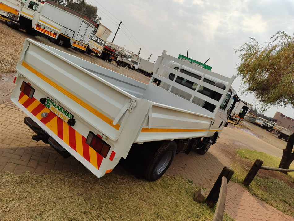 2005 Isuzu NMR 250 crew cab drop sides